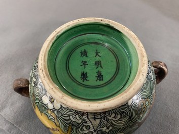 A Chinese verte biscuit 'flaming horses' censer, Jiajing mark, 18/19th C.